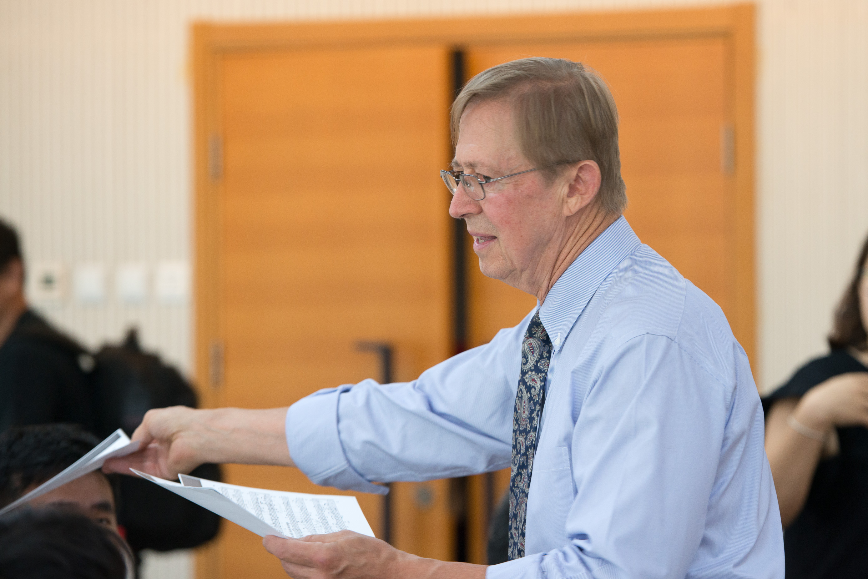 David hands out copies of the one of the chorale tunes that forms the basis of Symphony no. 8 and Songs for the Coming Day.
